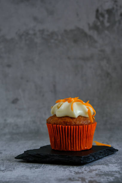 istock carrot muffin on a gray background 1353829301