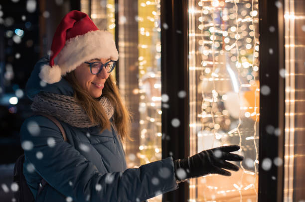 istock Pretty Woman in Santas hat 1353832845