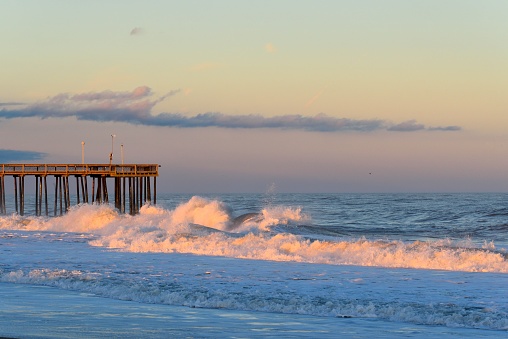 The Ocean City, MD beach and fishing pier at dusk in Autumn