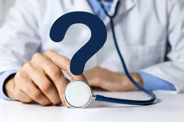 doctor with stethoscope and question mark. medical advice, health care confusion and faq concept