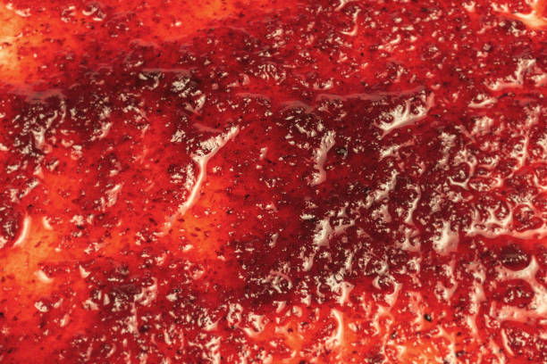 istock Red sweet jam background. Top view. 1353836914