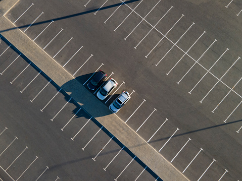City parking with 3 Cars viewed from above, Top Aerial view.