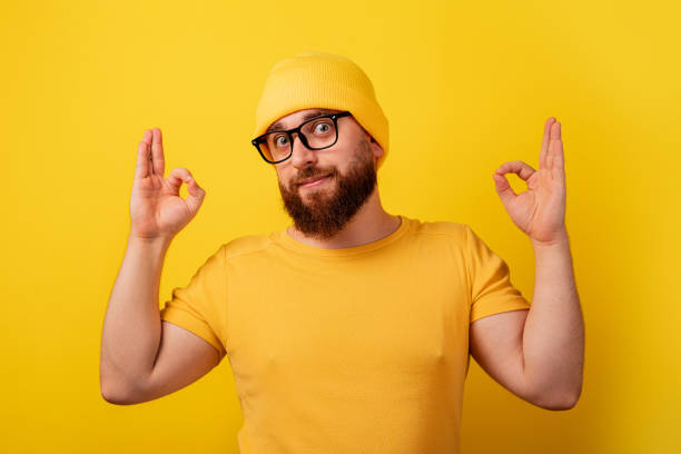istock bearded man in glasses showing ok gesture 1353837922
