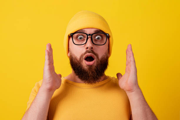 istock surprised man in glasses over yellow background 1353837998