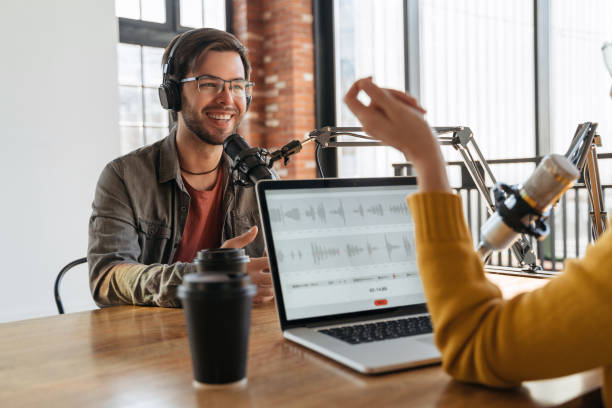 istock Two radio hosts recording audio podcast in studio 1353845032
