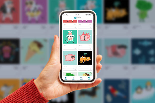 Close up of an NFT marketplace on a mobile phone NFT marketplace app on mobile phone with hands close up investment in crypto art non fungible tokens non fungible token stock pictures, royalty-free photos & images