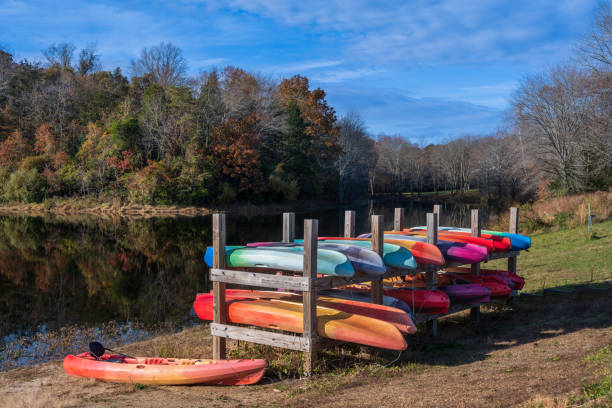 istock Colorful Canoes by a Lake 1353849992