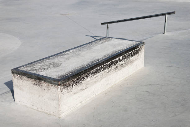 istock Skatepark concrete ledge. A box with coping for grinding and sliding. 1353850739
