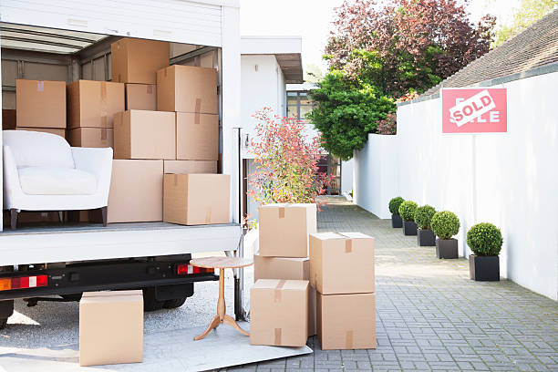 Boxes on ground near moving van  real estate sign photos stock pictures, royalty-free photos & images