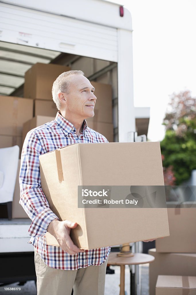 Man unloading box from moving van  Moving Van Stock Photo