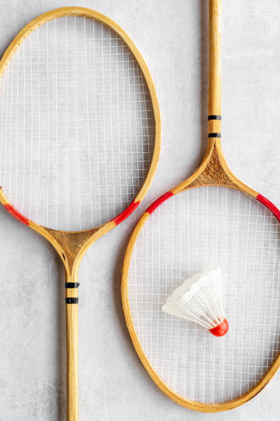 istock Two rackets and shuttlecock for playing badminton, top view 1353852206
