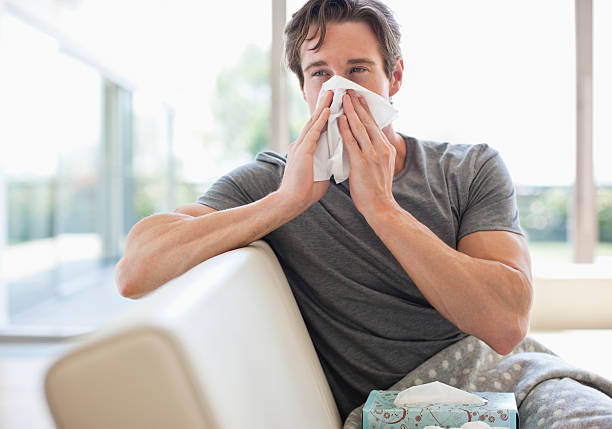 Sick man blowing his nose  handkerchief photos stock pictures, royalty-free photos & images