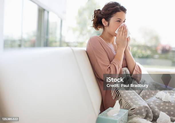 Sick Woman Blowing Her Nose Stock Photo - Download Image Now - Cold And Flu, Illness, Allergy
