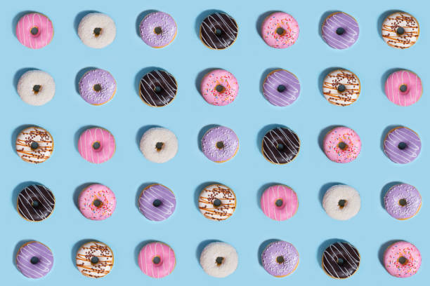 istock Colorful sweeties donuts over blue background. 1353856379