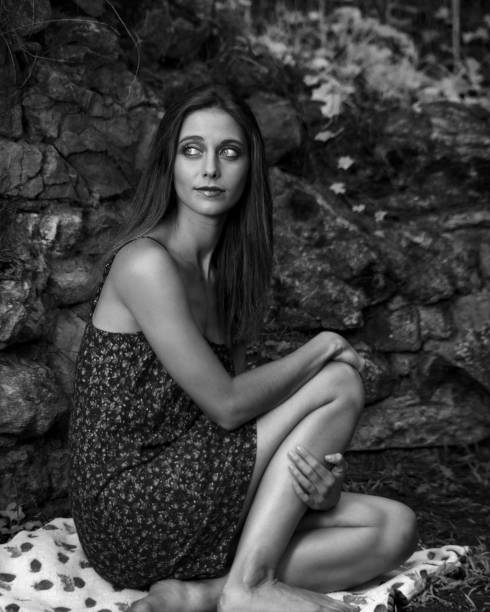istock Young Woman in a Floral Print Dress 1353860607