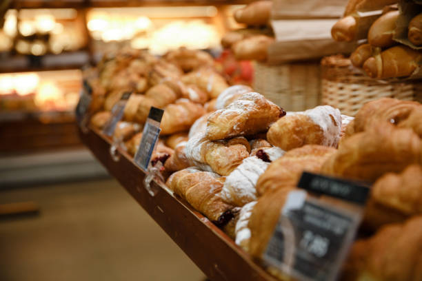 istock Sweet croissants in supermarket bakery 1353860626