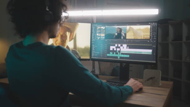 istock Male freelancer editing video at night 1353860807