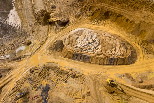 istock Gravel and sand open pit mining, sand hills - aerial view 1353863202