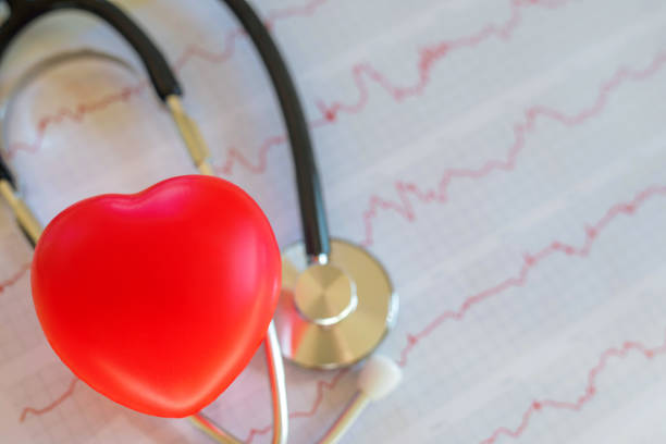 istock Stethoscope and heart on the diagramm 1353863329