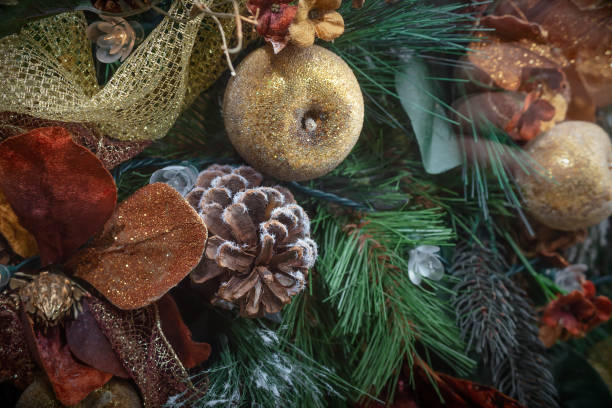 istock christmas tree decoration pine cone and ribbon yellow and brown 1353863570