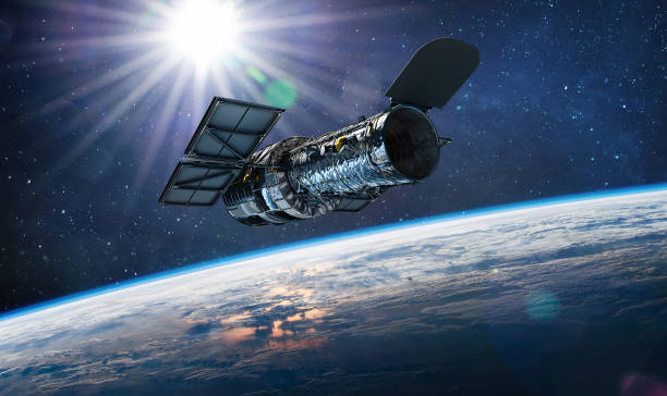hubble telescope on orbit of earth. space observatory. telescope in outer space near surface of blue planet. stars and sun. elements of this image furnished by nasa - 天文台 個照片及圖片檔