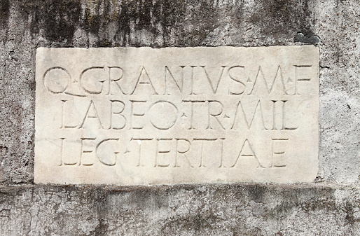 Ancient latin inscription in the Appian way of Rome, Italy