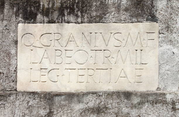 ancient latin inscription in the appian way of rome, italy - carved rock imagens e fotografias de stock