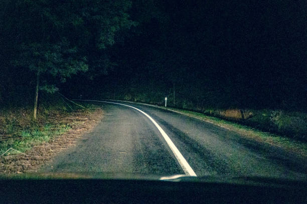 istock Driving on a road in the dark in Australia. 1353865539