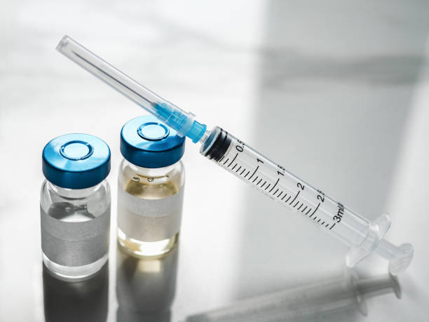 istock Syringes, injection bottles and tablets lying on the table 1353865544