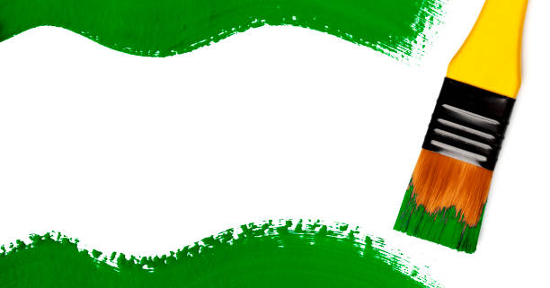istock Frame - paintbrush with green paint strokes (isolated on white) 1353867394