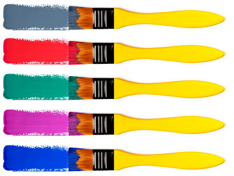 Set of 5 paintbrushes with multi colored paint strokes (gouache). Isolated on a white background.