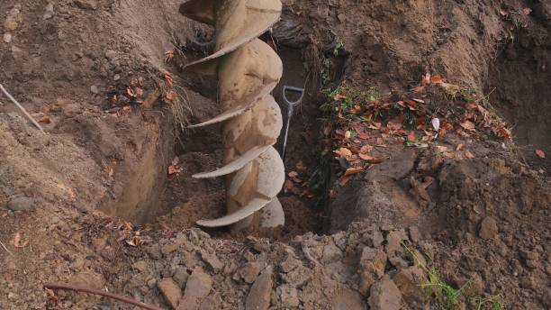 istock Heavy Duty Industrial Earthworks Machine Drill Rotating Excavating Ground 1353871016