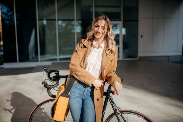 istock Business woman with a bicycle 1353871333