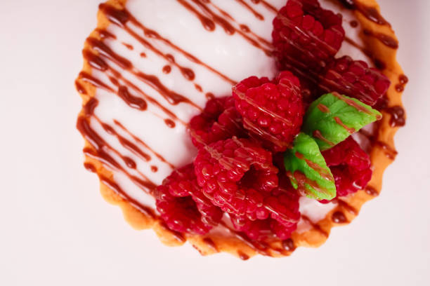 Fresh cake with raspberries in powdered sugar. Dessert in a cafe for breakfast. High quality photo