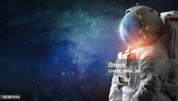 Astronaut In Outer Space Spaceman With Starry And Galactic Background Scifi Digital Wallpaper Stock Photo - Download Image Now