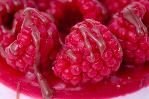 istock Fresh cake with raspberries in powdered sugar. Dessert in a cafe for breakfast. 1353877494