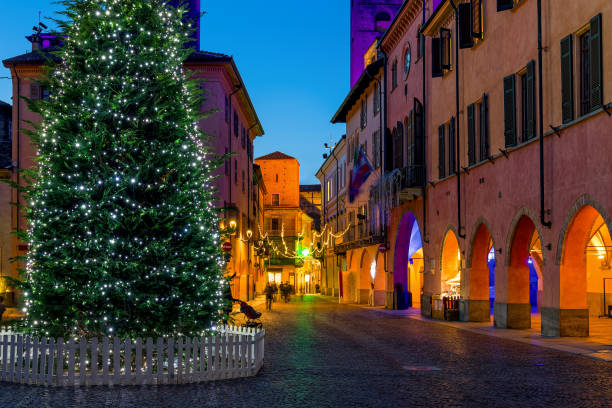 istock Illuminated Christmas tree on town square in Alba, Italy. 1353879062