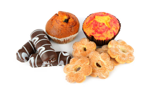 istock Cookies and muffins isolated on white background. 1353879154