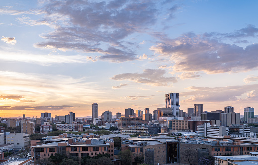 Aerial shot of Pretoria city skylines during a colorful sunset