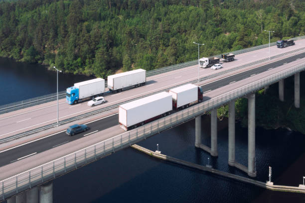 istock Trucks with trailers on the road 1353884058