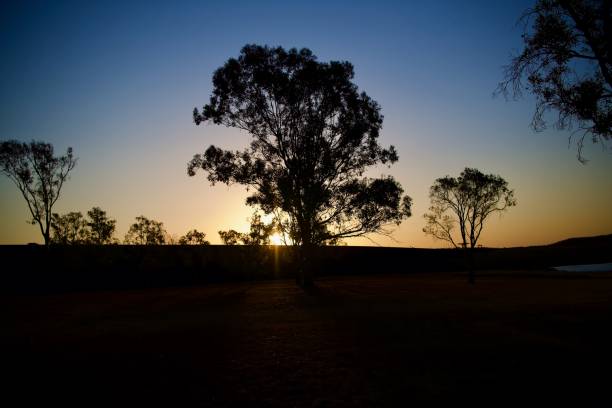 istock Golden Sunset, Maize Yellow Rays, Rock Blue Sky 1353890166