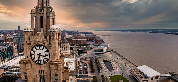 Aerial close up of the tower of the Royal Liver Building in Liverpool, UK during beautiful sunset.