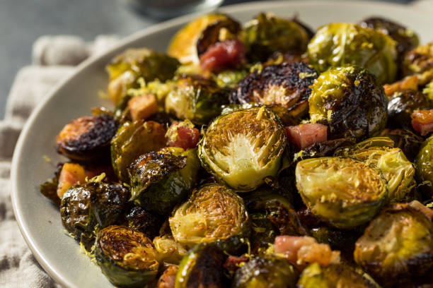 Healthy Organic Baked Brussel Sprouts Healthy Organic Baked Brussel Sprouts with Pancetta brussels sprout stock pictures, royalty-free photos & images