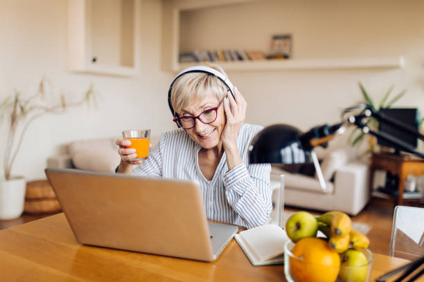 istock Senior freelancer working at her home office 1353897952