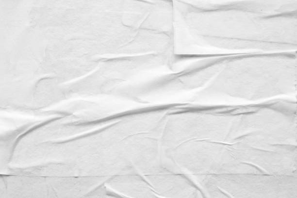 istock Blank white crumpled and creased paper poster texture 1353898817