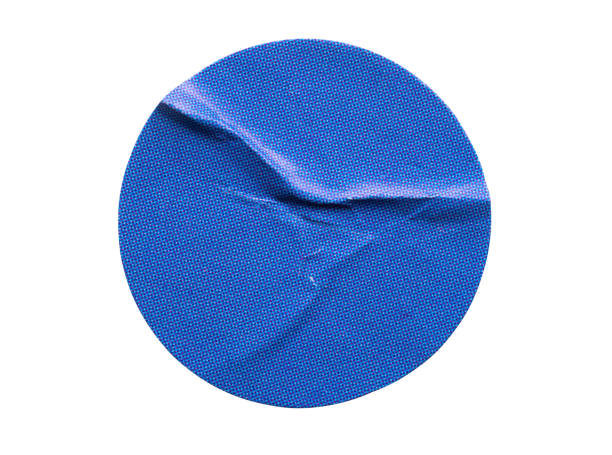 istock Blank blue round adhesive paper sticker label isolated on white background 1353898881