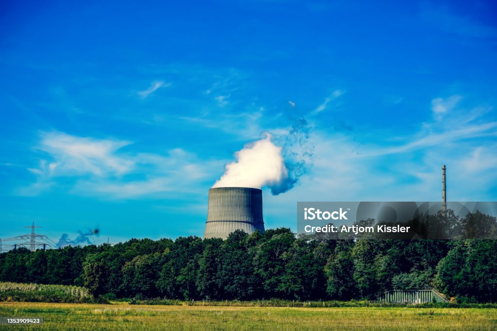 Nuclear power plant near a forest. Uranium Stock Photo