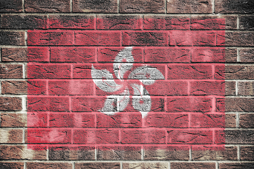 A Hong Kong flag painted on brick wall background