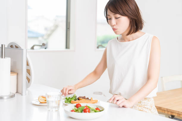 istock attractive asian woman who eats 1353913753
