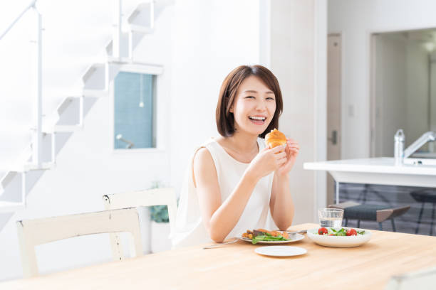 istock attractive asian woman who eats 1353913774